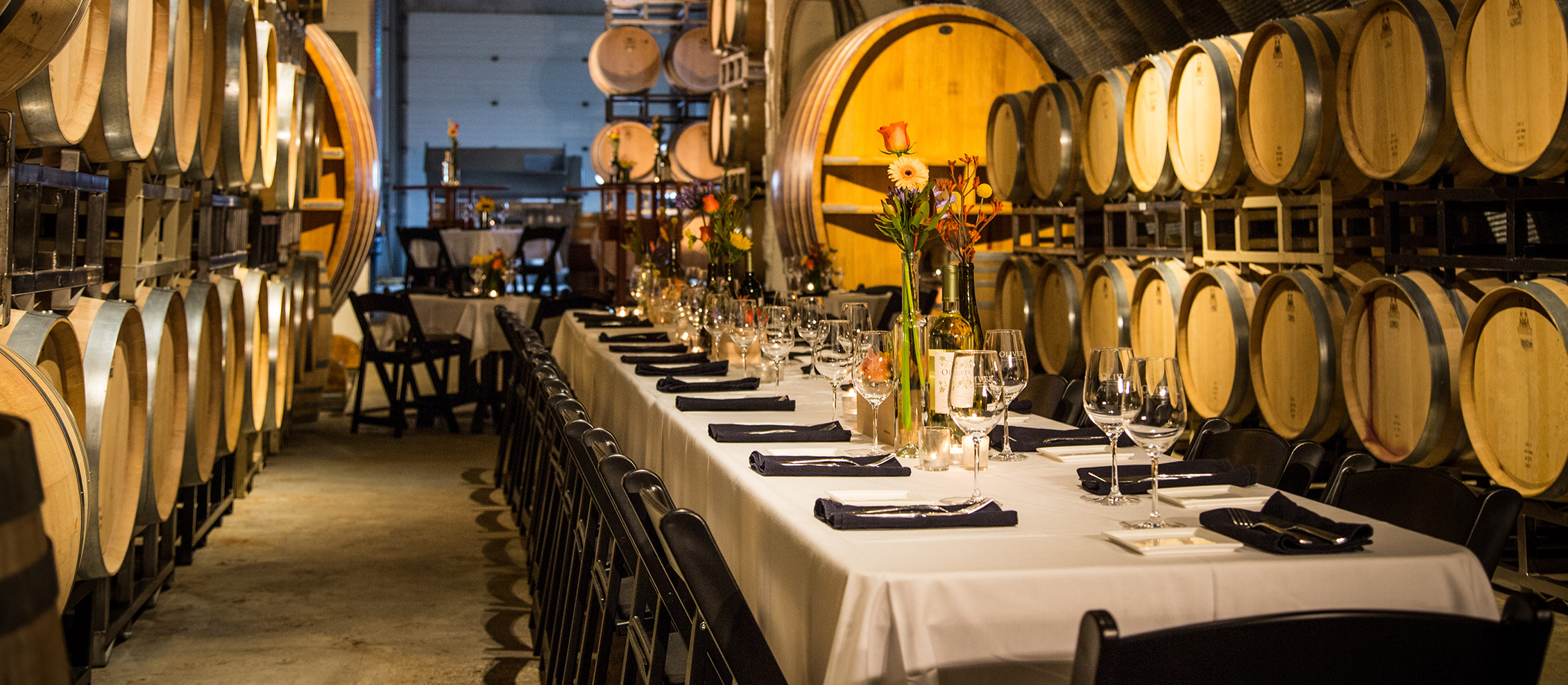 Oliver Winery cellar room setup for an intimate rehearsal dinner.