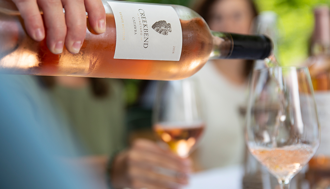 Uncorking a bottle of sweet wine.