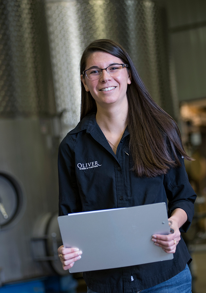 Allison checking on the stainless steel tanks at the winery.