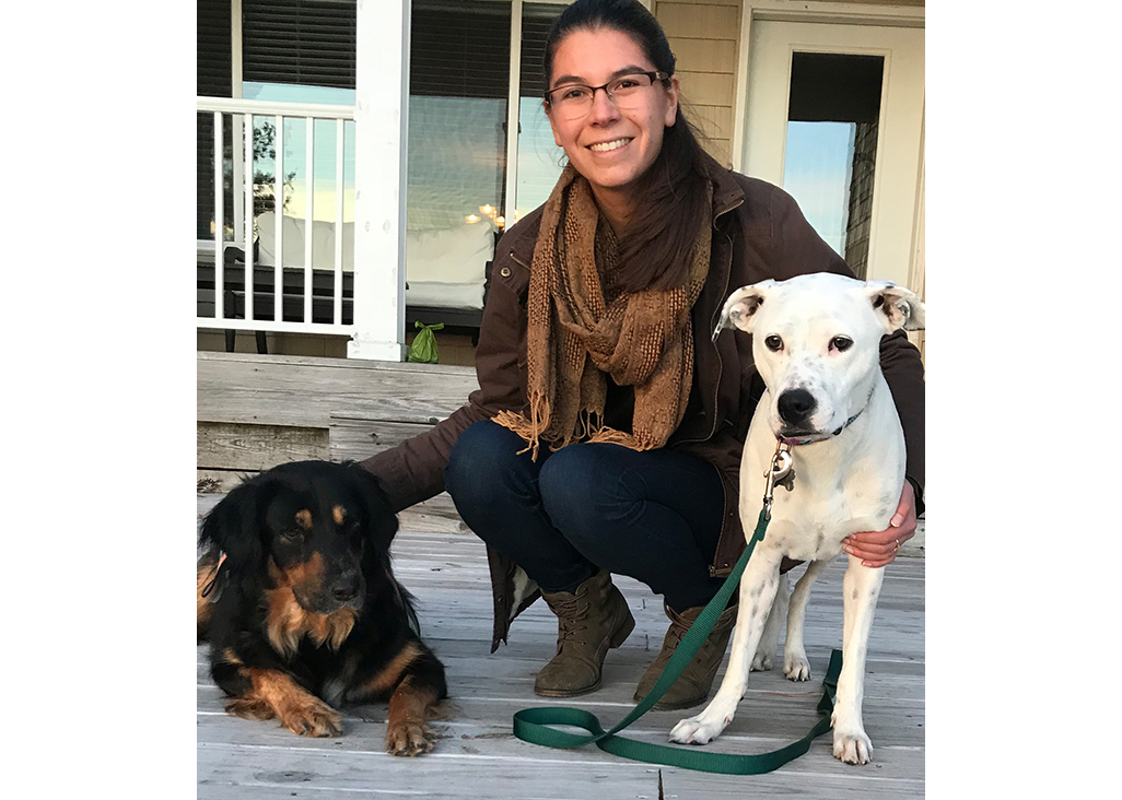 Allison enjoys a glass of wine with her dogs.