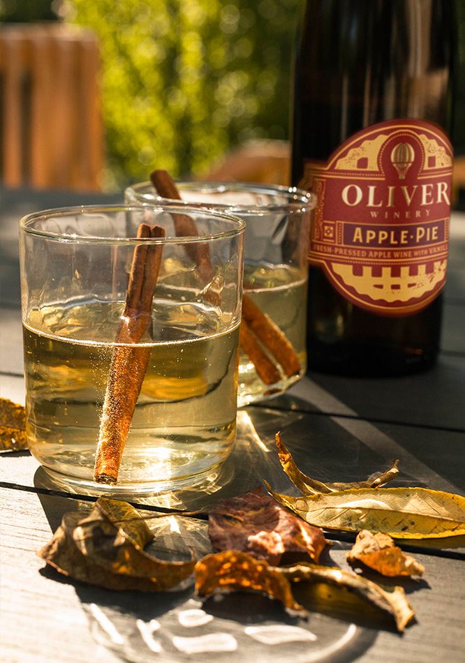 Oliver Winery Apple Pie wine, served warm with honey and cinnamon sticks