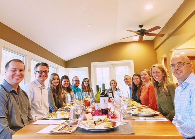Oliver Staff celebrating Thanksgiving around a table together