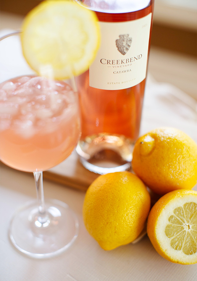 Catawba Lemonade with fresh lemons on kitchen table