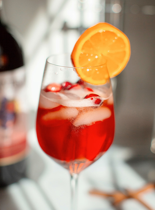A bright & fruity Sangria Spritz ready for holiday parties and cozy winter days.