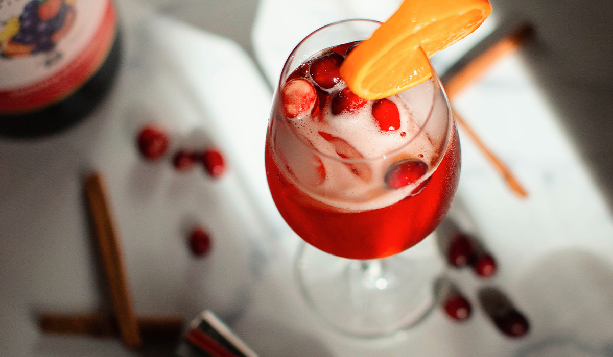 A bright & fruity Sangria Spritz ready for holiday parties and cozy winter days.