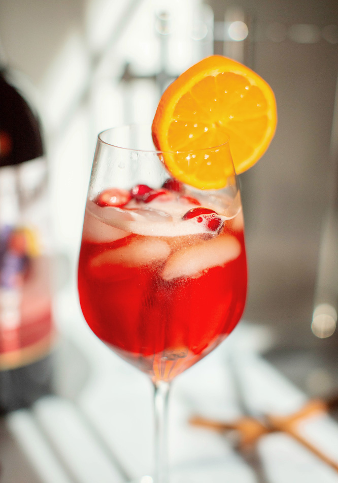 A bright & fruity Sangria Spritz ready for holiday parties and cozy winter days.