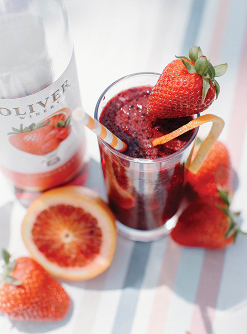 Frosé Sangria with Oliver Winery's Cosmoberry, garnished with strawberries & blood orange.