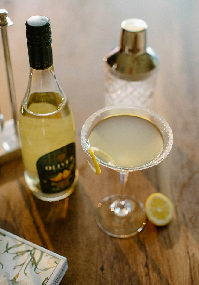 Oliver Winery's newest release, Blossom Drop, in a simple Lemon Drop cocktail with a sugar rim and lemon twist garnish.
