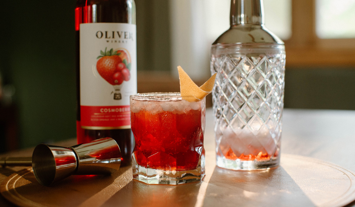 Oliver Winery's Cosmoberry in a cozy bourbon cocktail with flavors of cranberry, strawberry, and blood orange.