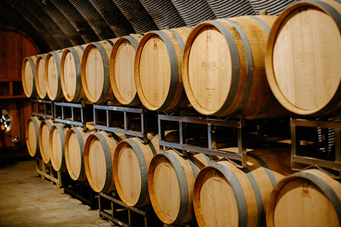 Barrels line the inside of the Oliver Winery cellar.