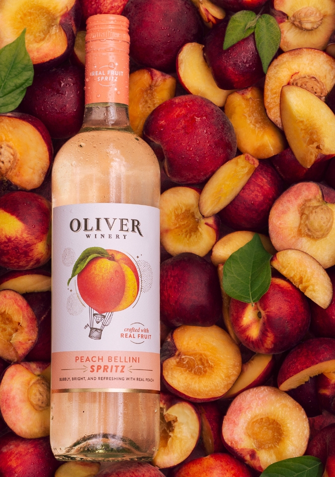Oliver Peach Bellini Spritz On Top of Grapefruit Slices