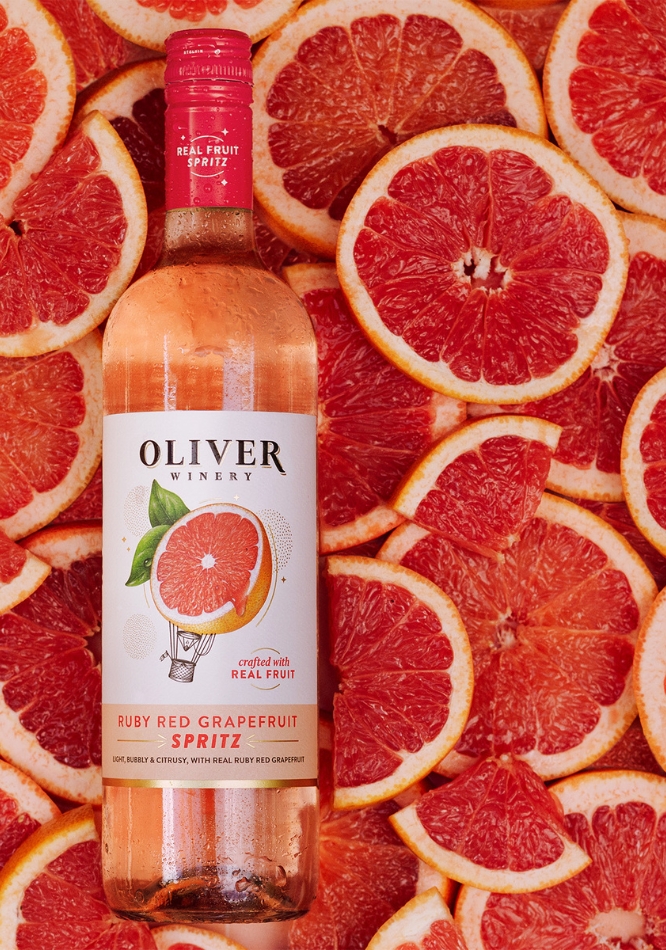 Oliver Winery Ruby Red Grapefruit Spritz Overlaid on Grapefruit Slices