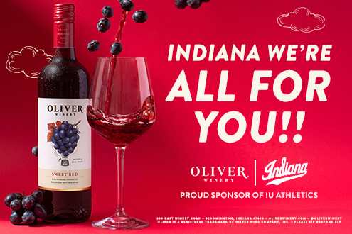 Oliver Sweet Red bottle and a glass of red wine on a crimson background with the message “Indiana, we’re all for you!” and Proud Sponsor of IU Athletics designation. Please sip Responsibly